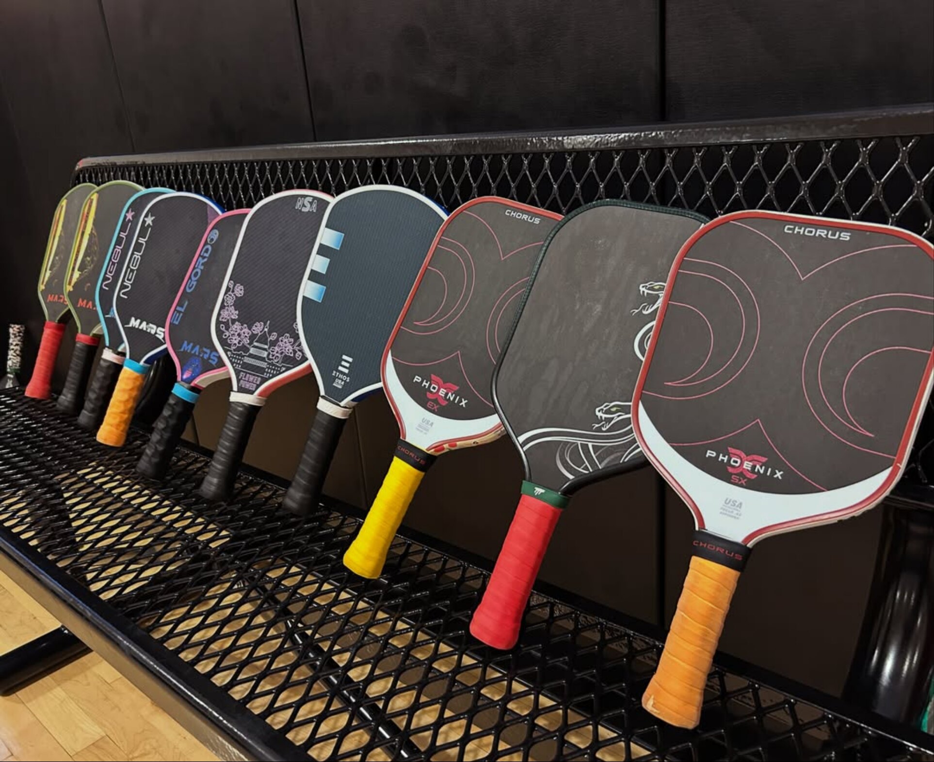 A lineup of pickleball paddles from the brands Coach Ronnie reps